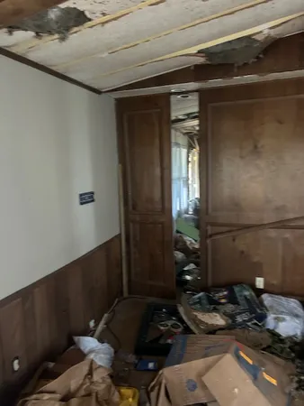 a room with water heater and wooden floor