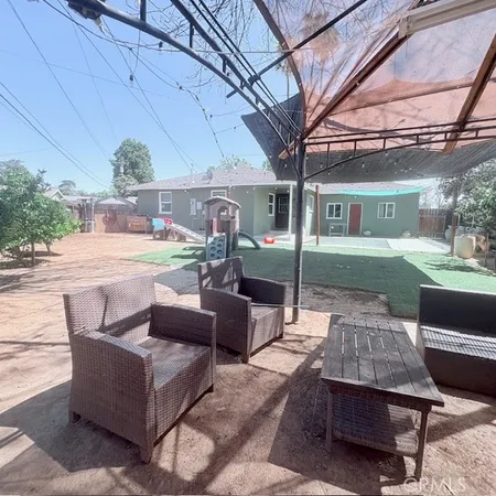a outdoor living space with furniture and a potted plant