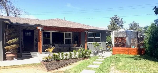 a front view of a house with patio