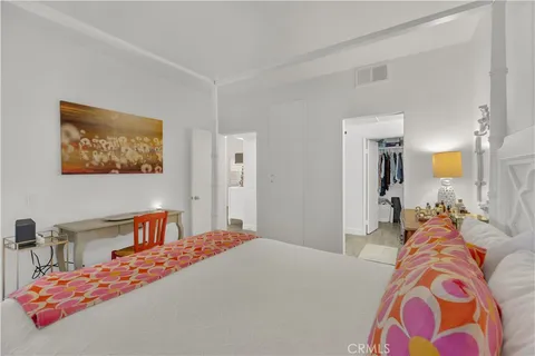 a bedroom with bed and a lamp