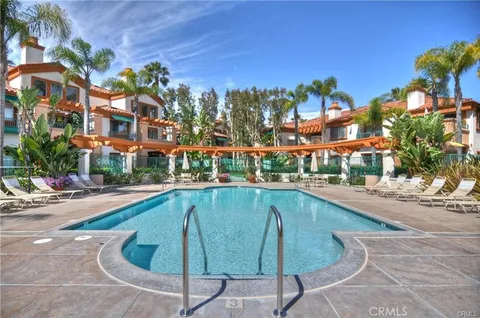 a swimming pool with outdoor seating and yard