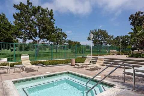 a view of a patio with a patio table and chairs