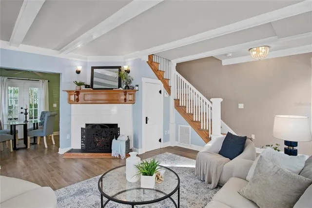 a living room with furniture and a fireplace