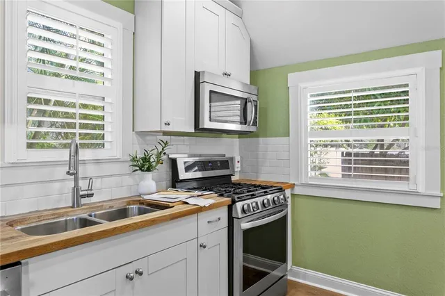 a kitchen with granite countertop a sink and a window