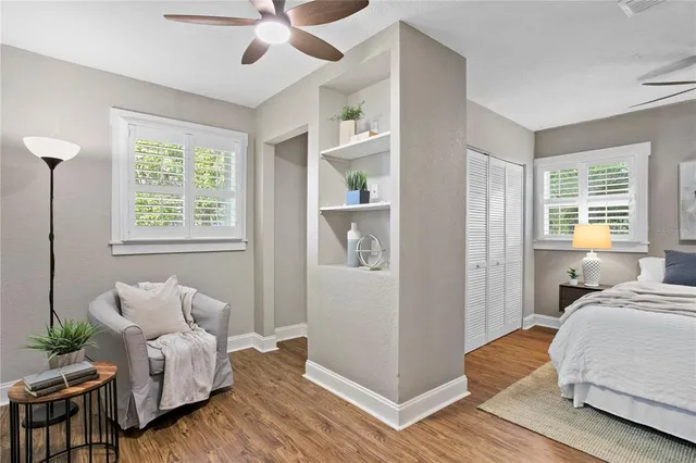 a bedroom with furniture and a window