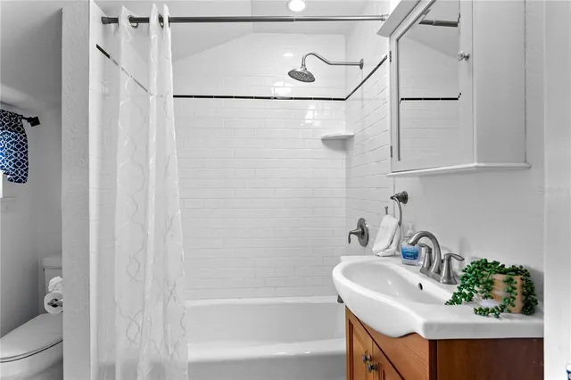 a bathroom with a sink and a shower