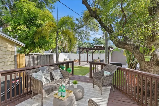 a view of a patio with iron fence