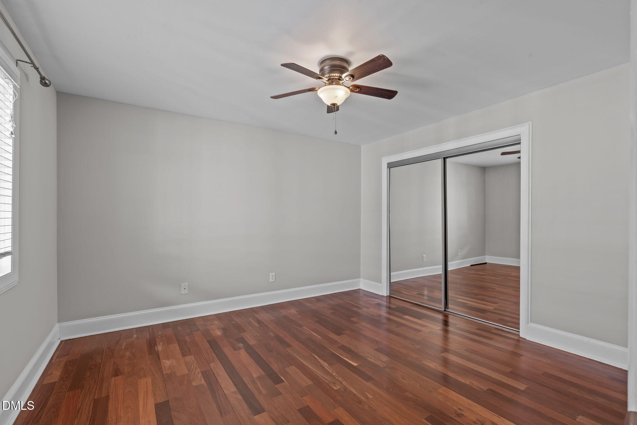 2208 Stafford Avenue Raleigh, NC 27607 - Photo 16 of 30 a view of an empty room with wooden floor and a window