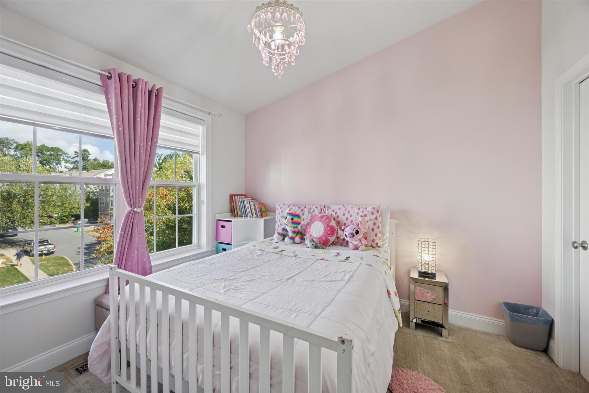 213 Corvus Circle Media, PA 19063 - Photo 24 of 34 a bedroom with a bed and a large window