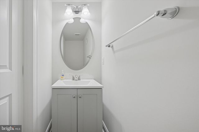 a view of a patio with table and chairs and potted plants