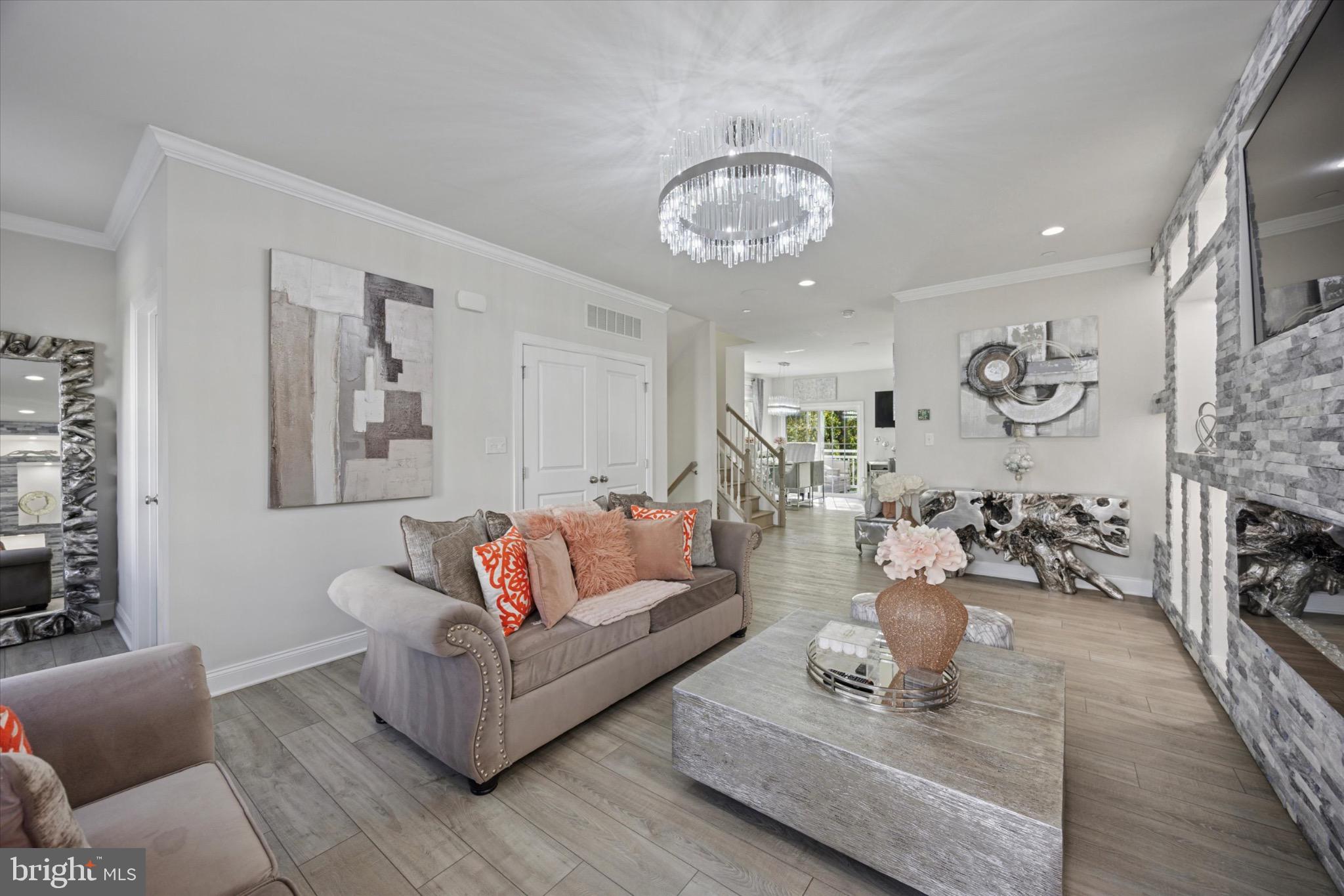 213 Corvus Circle Media, PA 19063 - Photo 4 of 34 a living room with furniture kitchen view and a wooden floor