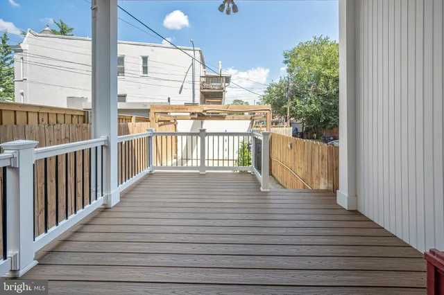 a view of a balcony with wooden floor