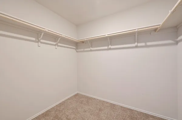 a view of an empty walk in closet