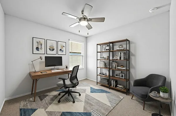 a workspace with furniture and fan