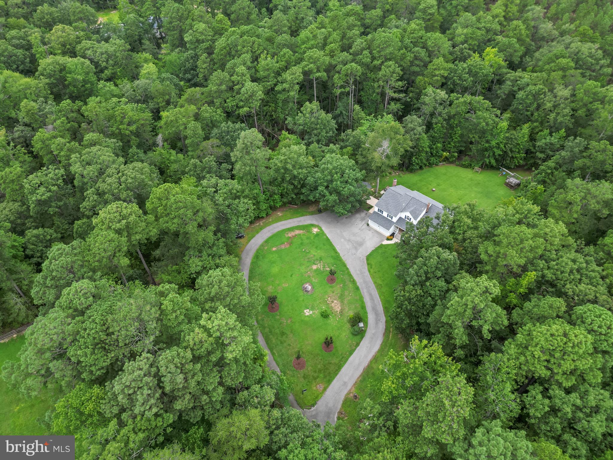 20919 Ridge Path Way Leonardtown, MD 20650 - Photo 1 of 56 an aerial view of a house with a yard and trees