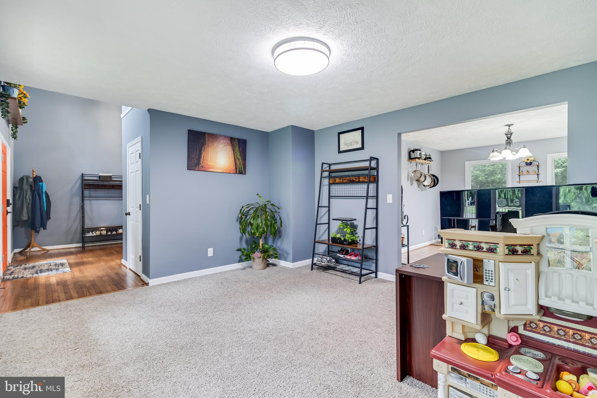 20919 Ridge Path Way Leonardtown, MD 20650 - Photo 15 of 56 a view of a kitchen with furniture and flat screen tv