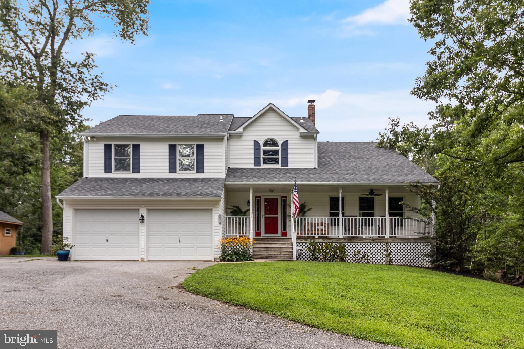 20919 Ridge Path Way Leonardtown, MD 20650 - Photo 2 of 56 a front view of a house with a garden