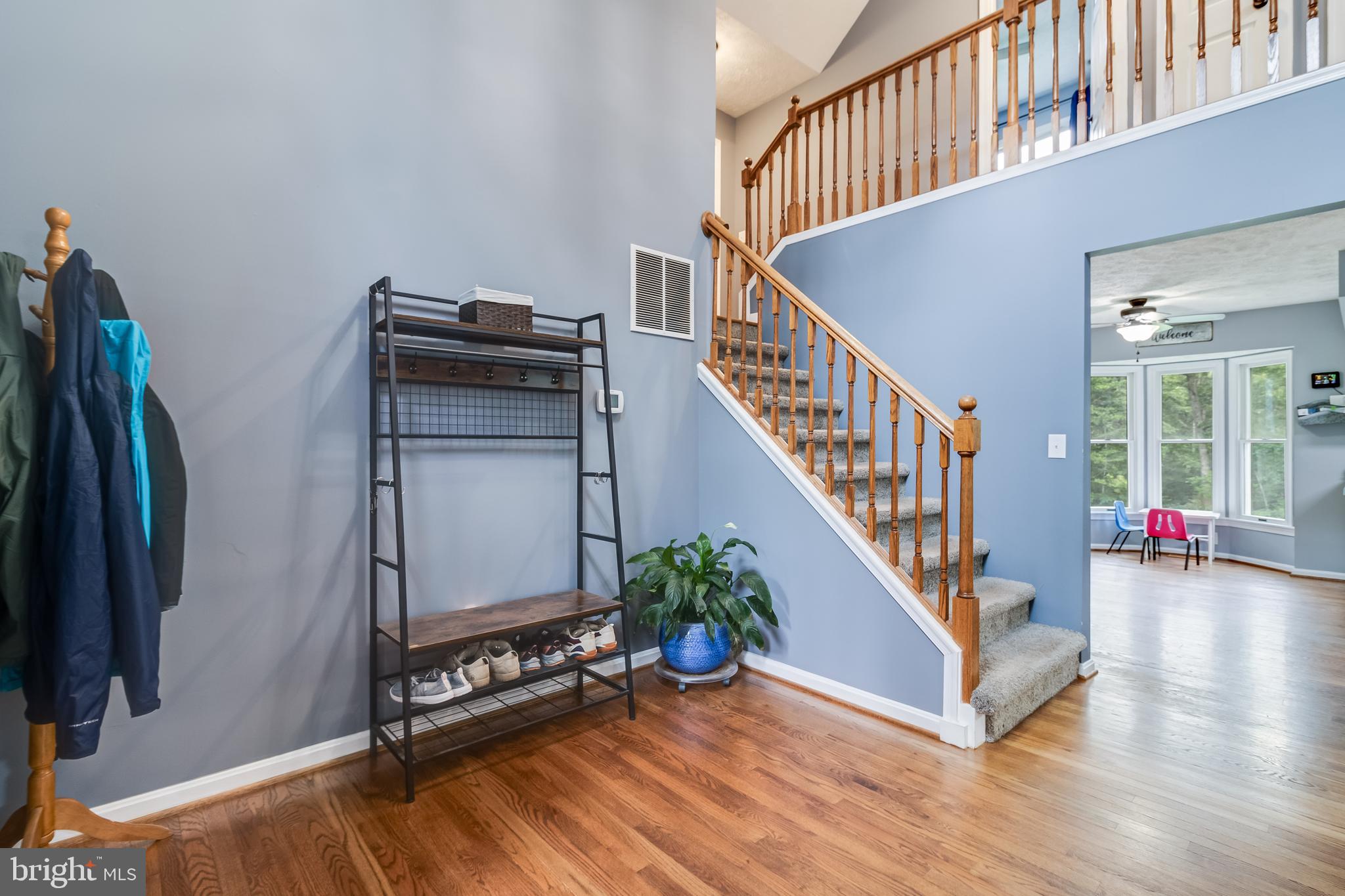 20919 Ridge Path Way Leonardtown, MD 20650 - Photo 26 of 56 a view of an entryway with wooden floor and stairs