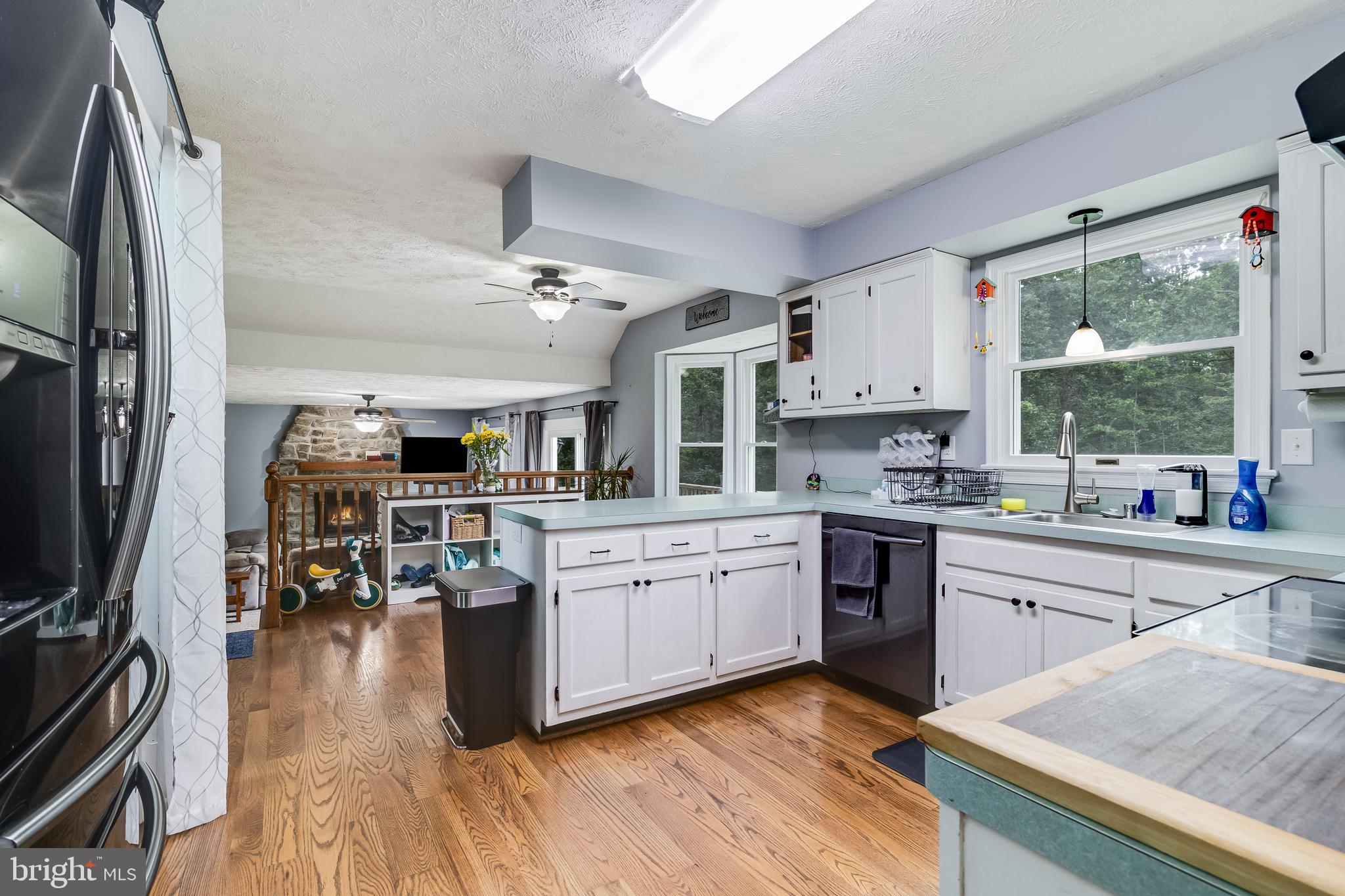 20919 Ridge Path Way Leonardtown, MD 20650 - Photo 29 of 56 a kitchen with stainless steel appliances granite countertop lots of counter top space and wooden floors