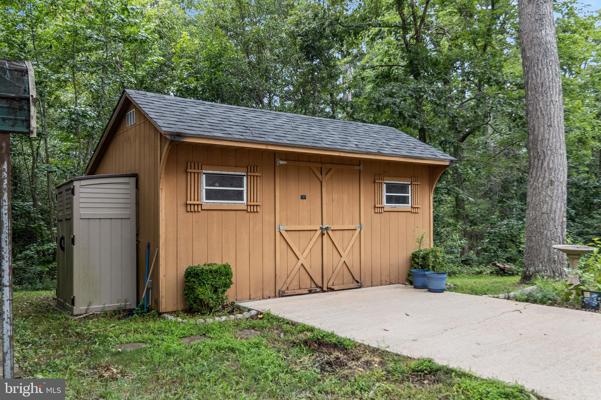20919 Ridge Path Way Leonardtown, MD 20650 - Photo 39 of 56 a house with lots of trees in the background