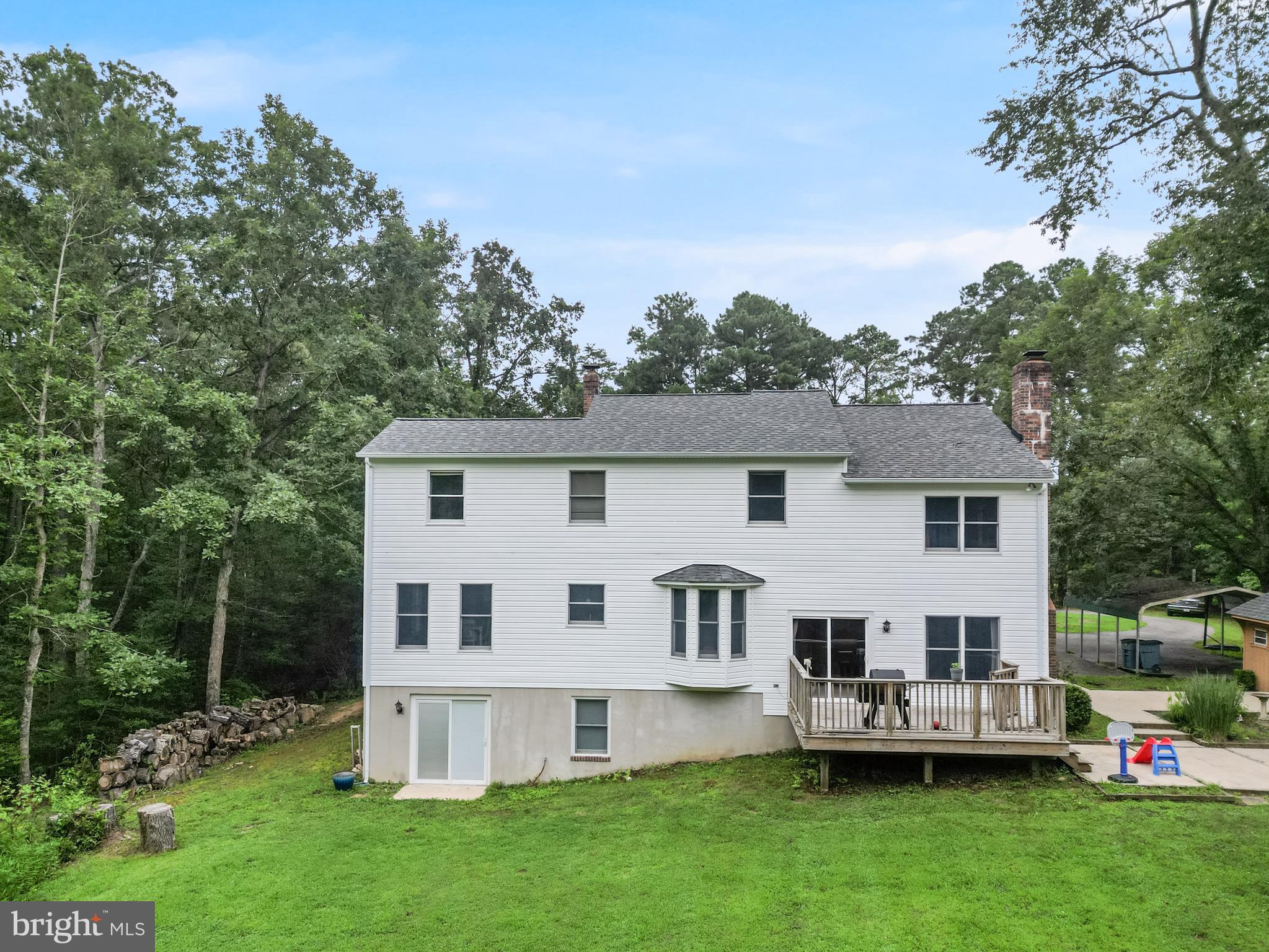 20919 Ridge Path Way Leonardtown, MD 20650 - Photo 46 of 56 a view of a house with a yard and sitting area