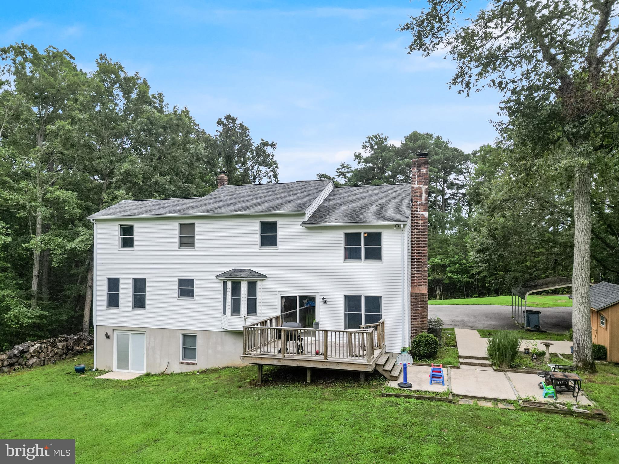 20919 Ridge Path Way Leonardtown, MD 20650 - Photo 47 of 56 a front view of a house with a garden and trees