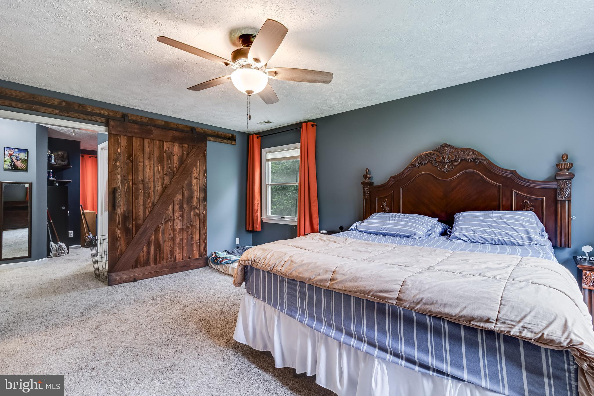 20919 Ridge Path Way Leonardtown, MD 20650 - Photo 8 of 56 a bedroom with a bed and a chandelier