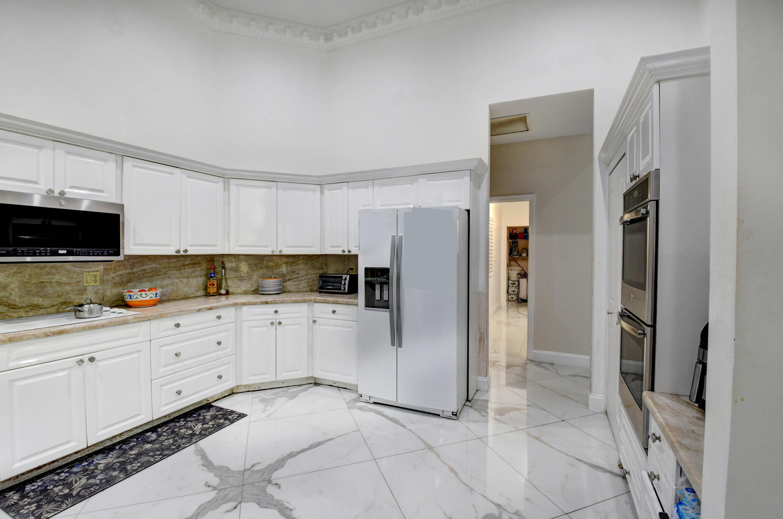 4701 Pine Tree Drive Boynton Beach, FL 33436 - Photo 20 of 35 4701 kitchen to fridge