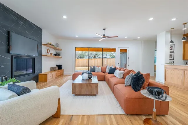 a living room with furniture and a large window