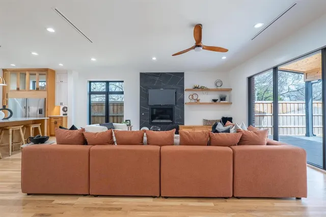 a living room with furniture and a large window