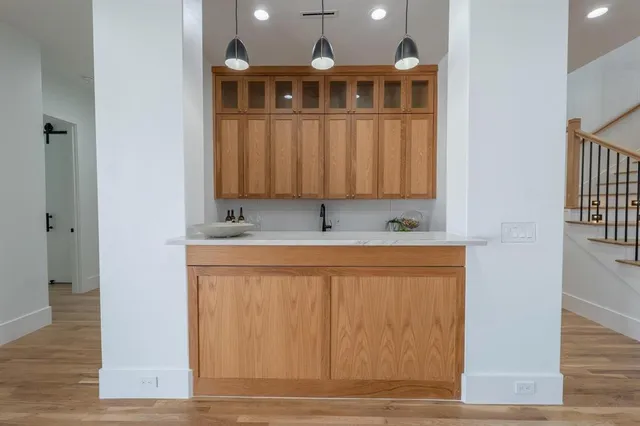 a view of en suite bathroom with toilet and a window