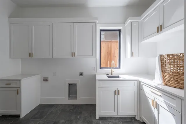 a bathroom with a sink and a window