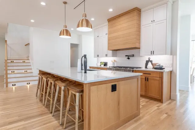 a kitchen with wooden cabinets and white appliances