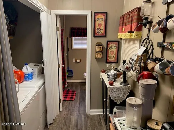 a room with furniture a rug and a window