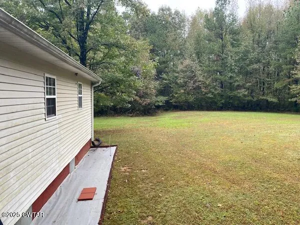 a view of a outdoor space with swimming pool