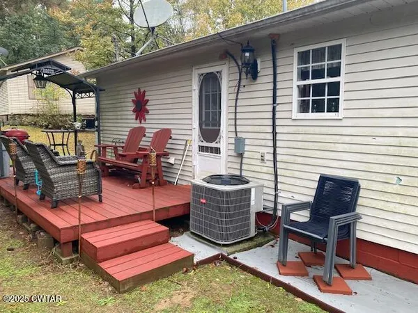 a outdoor space with patio the couches and a dining table with garden view