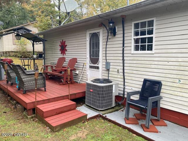 1885 Blue Goose Road Huron, TN 38345 - Photo 21 of 31 a outdoor space with patio the couches and a dining table with garden view