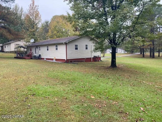 a house with a tree in the grass