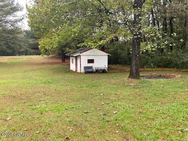 a big house with a big yard and large trees