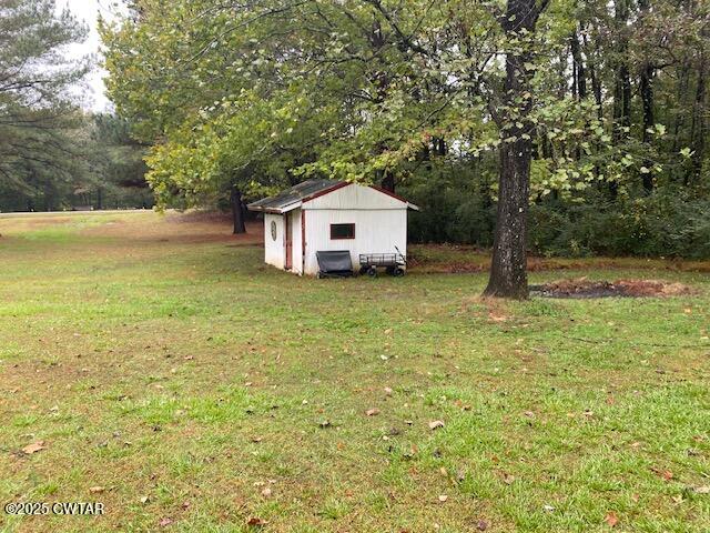 1885 Blue Goose Road Huron, TN 38345 - Photo 27 of 31 a big house with a big yard and large trees