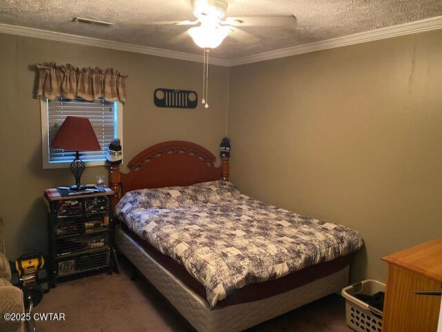 1885 Blue Goose Road Huron, TN 38345 - Photo 8 of 31 a bedroom with a bed and a chandelier
