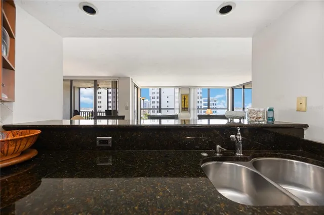 a kitchen with a sink and chandelier