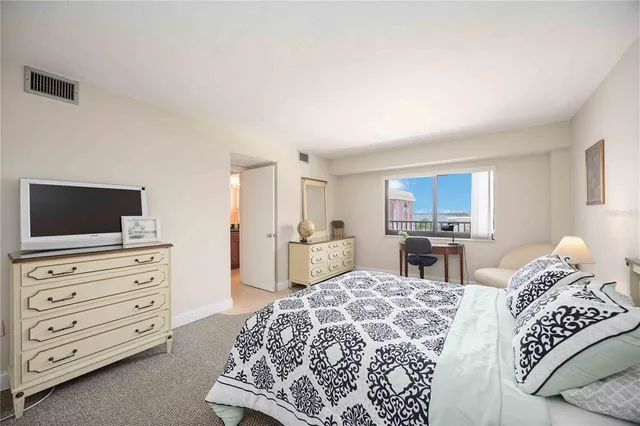 a bedroom with a bed and furniture