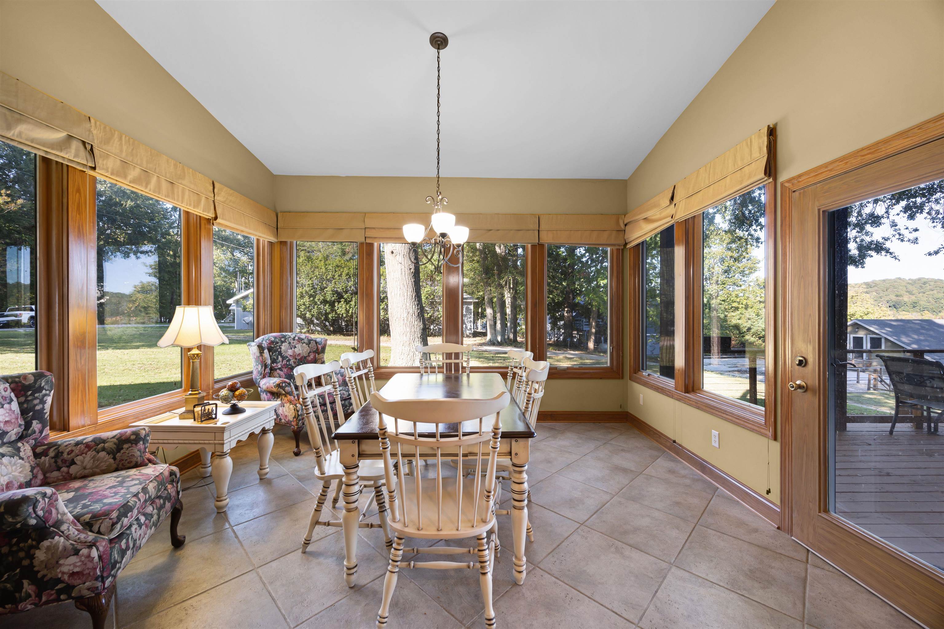 830 Big Bear Creek Road Cherokee, MS 35616 - Photo 11 of 39 Sunroom / solarium with a notable chandelier and vaulted ceiling