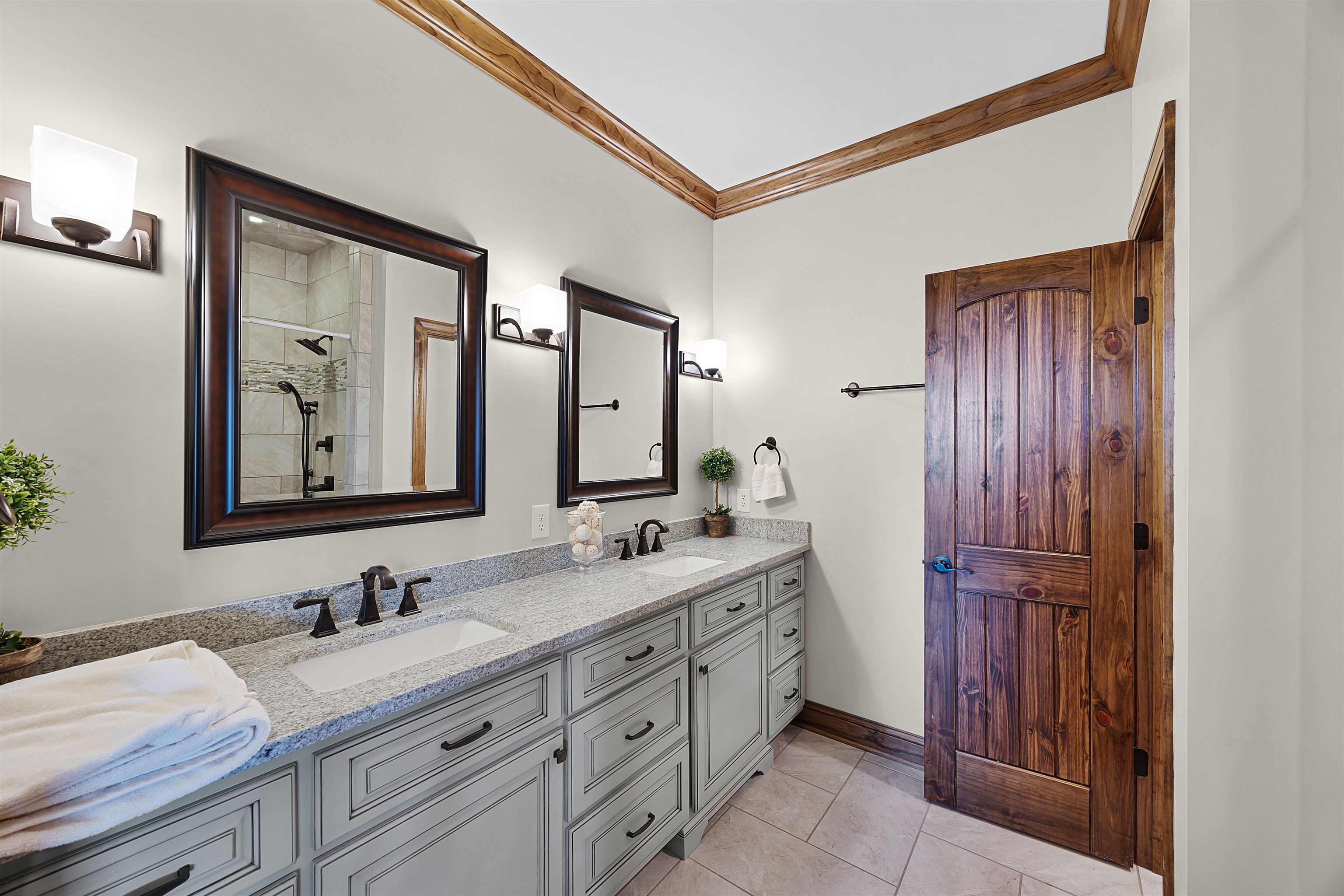 830 Big Bear Creek Road Cherokee, MS 35616 - Photo 34 of 39 Bathroom featuring crown molding, tile patterned flooring, vanity, and a shower