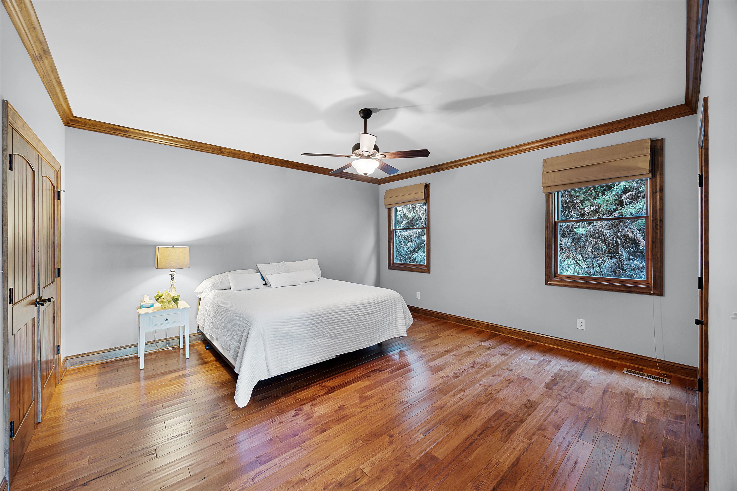 830 Big Bear Creek Road Cherokee, MS 35616 - Photo 35 of 39 Bedroom featuring ornamental molding, multiple windows, ceiling fan, and hardwood / wood-style floors