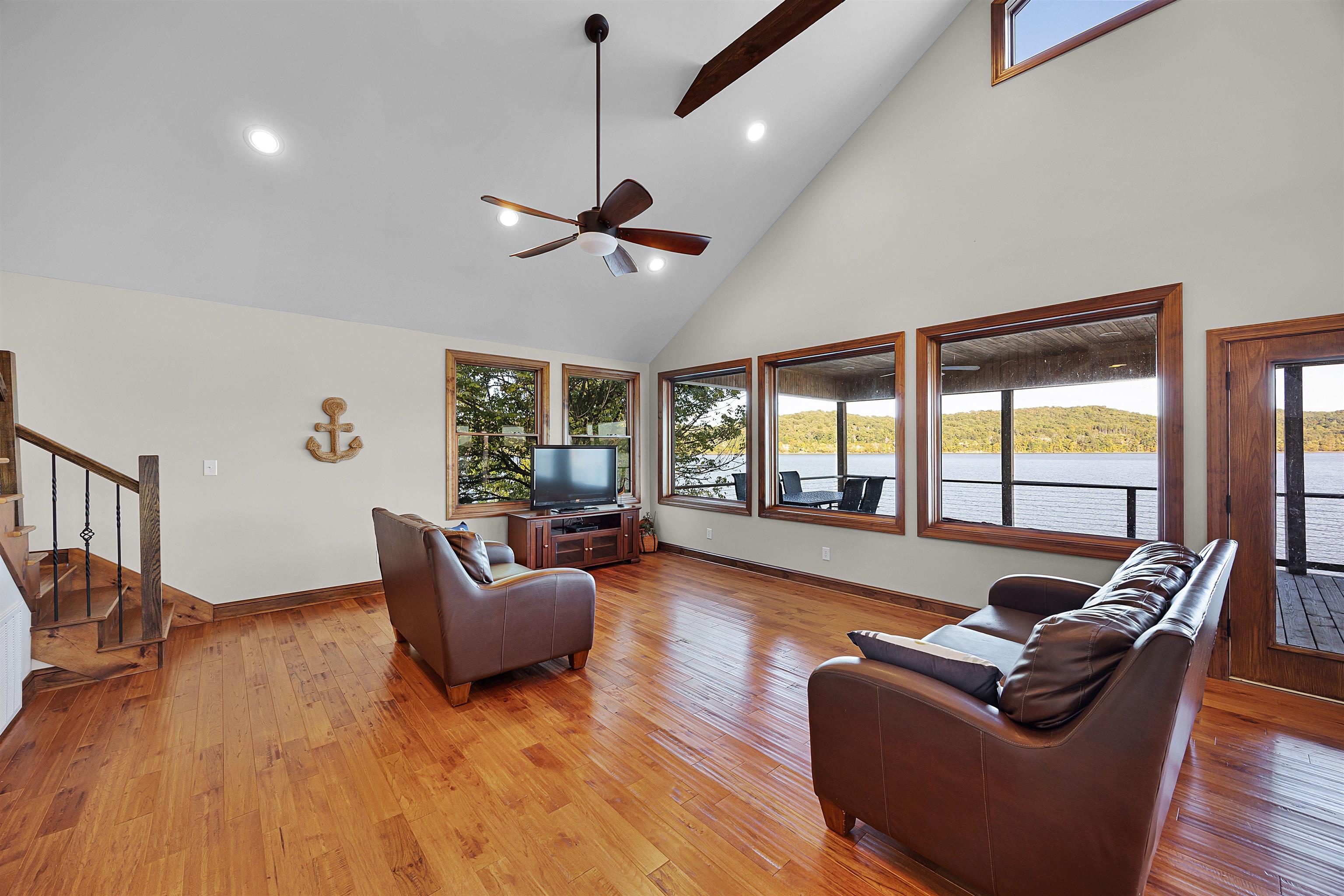 830 Big Bear Creek Road Cherokee, MS 35616 - Photo 7 of 39 a living room with furniture ceiling fan and a large window