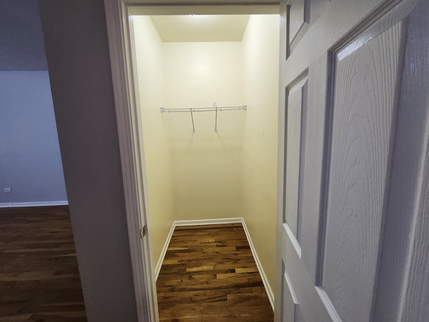 8016 South Ingleside Avenue, Unit 2S Chicago, IL 60619 - Photo 5 of 8 a view of a hallway with wooden floor and staircase