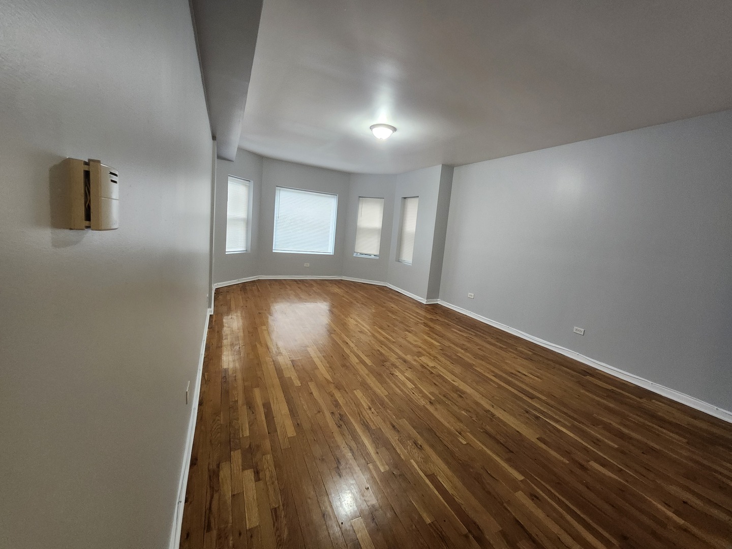 8016 South Ingleside Avenue, Unit 2S Chicago, IL 60619 - Photo 8 of 8 a view of empty room with wooden floor