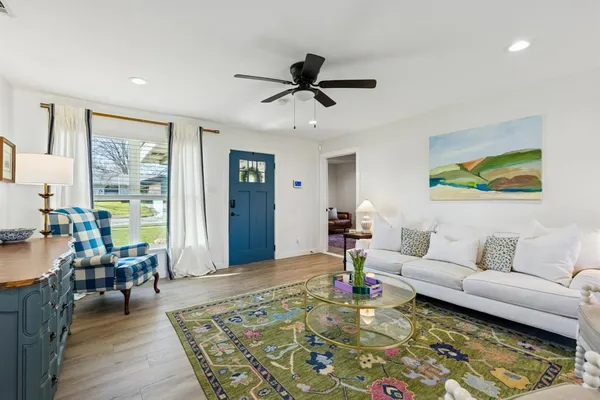 a living room with furniture and a rug